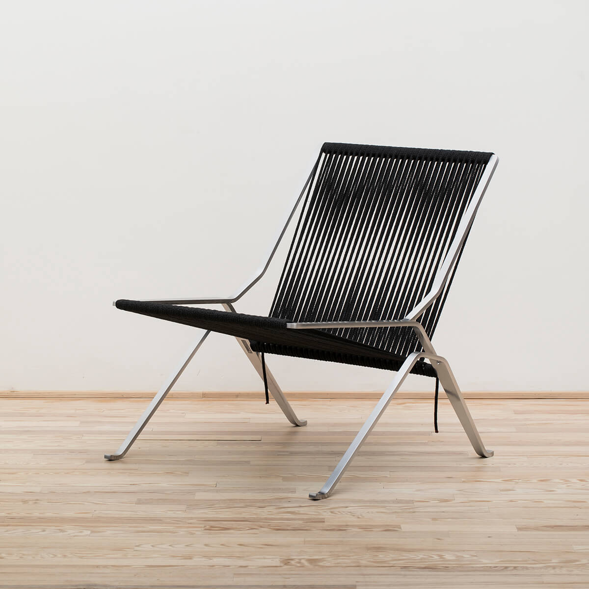 Sillón PK25 Cuerda negra Stock - Fritz Hansen